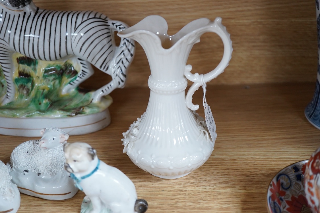 A pair of Worcester 'owl' candle snuffers, Staffordshire Zebra and two sheep, Belleek etc zebra 19cm wide.